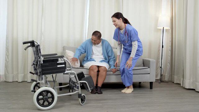 Female caregiver, aged care support helping mature women patient to recover injured leg, physiotherapy, take wheelchair for patient.