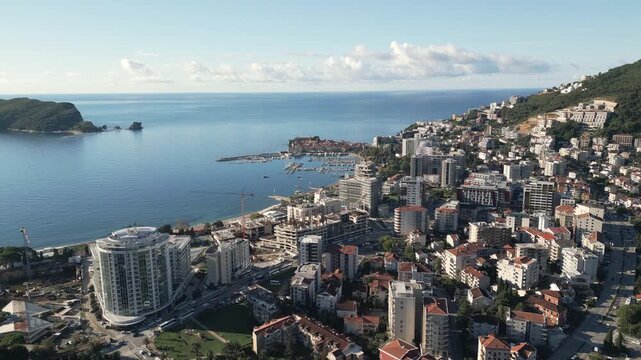Panoramic view of Budva, a coastal city located in southern Crna Gora. Drone video, flying forwards.