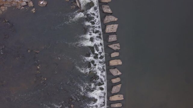 Top down drone shot of stepping stones over Tancheon stream in Seongnam