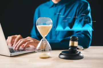 Hourglass, legal gavel, clock timer, time deadline, justice concept, professional working laptop,...
