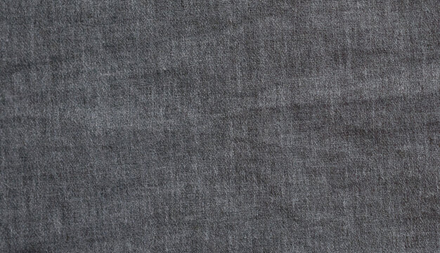 A close-up view of textured grey fabric.