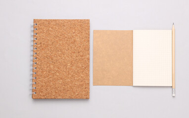 Fototapeta premium Spiral notebook and diary on a gray background