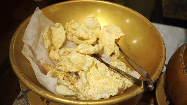 Crispy Indian roasted papadum seasoned with black pepper and spices, served as a crunchy accompaniment to a traditional meal.