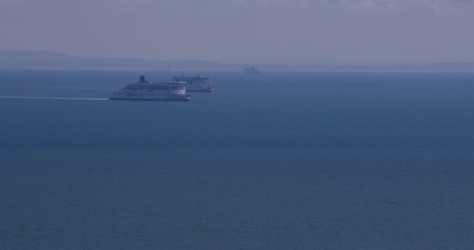Long shots of two ferries overtaking each other on the English Channel