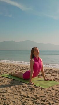 Aerial View Of Woman Doing Yoga On Da Nang Beach At Sunrise