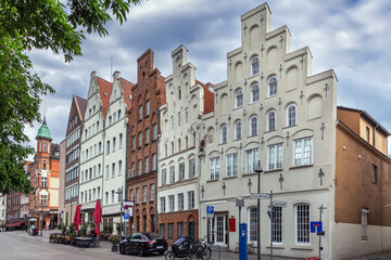 Obraz premium Historic houses on the Trave River embankment in Lubeck, Germany
