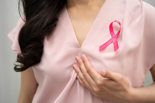 Asian woman with pink ribbon, World Breast Cancer Day at October.