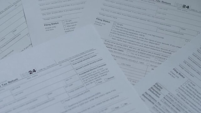 Close-up of Rotating 1040 Tax Form Blanks, Individual Tax Payment Concept, Income Declaration Filling