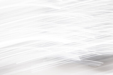 Obraz premium Abstract white light rain texture, vertical motion blur streaks on grey background, brushed metal effect or digital signal interference.