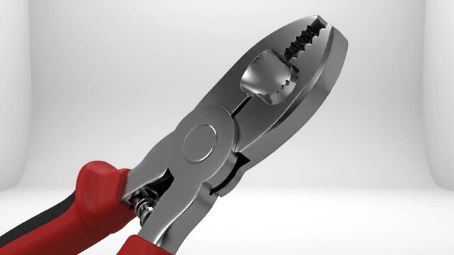 Close up of a plier tool with red and black handles against white