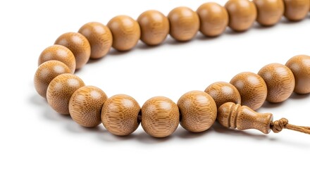 Close-up of a Muslim prayer beads made of wood on a white background.