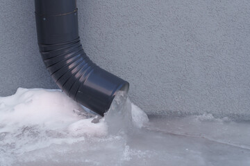 frozen rainwater drainpipe