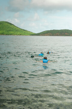Group of snorkelers float near shore at Tamarindo Beach, Culebra