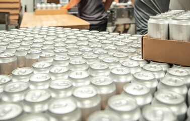 beverage cans on at end of production line