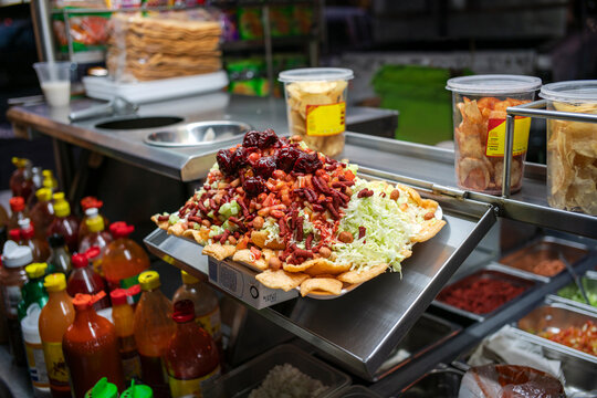 Platter of chips piled high with a variety of toppings