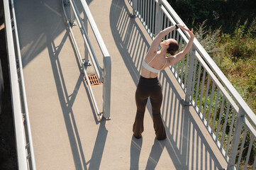 Fitness Woman Stretching on Outdoor Ramp