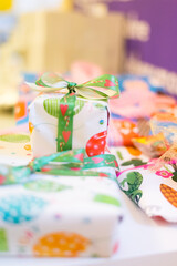 Fototapeta premium A detail of a wrapped birthday gift box at children's birthday party