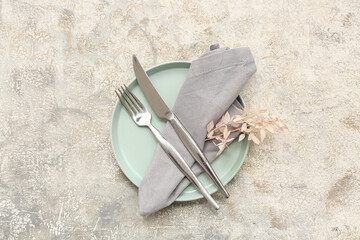 Stylish table setting with beautiful flowers on grey background