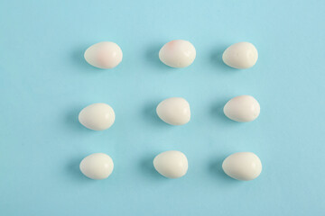 Fresh boiled quail eggs on blue background