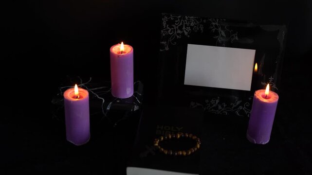       funeral, photo frame, candles, marble urn for ashes, holy bible and spiritual bracelet with black cross