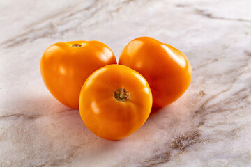 Ripe raw yellow tomato heap