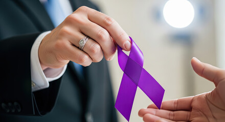 Man handing purple awareness ribbon to another person indoors  