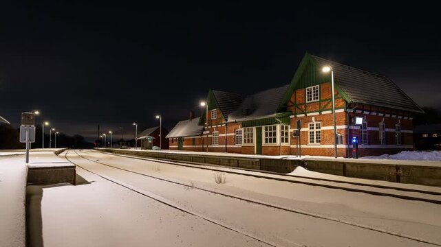 Two local diesel trains meet at the small station &Oslash;lsted near Hiller&oslash;d in Denmark. Timelapse clip on a snowy day.