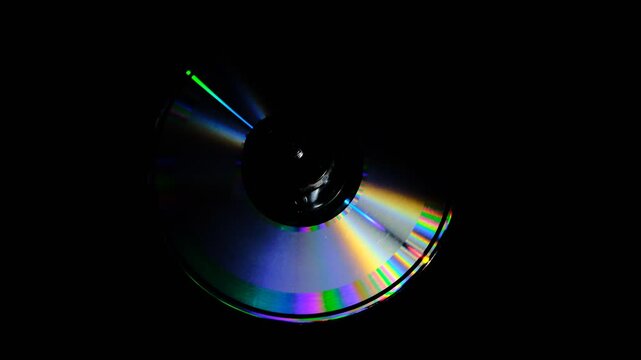 Abstract concept, colorful CD DVD  iridescent laser disc on a black isolated background
