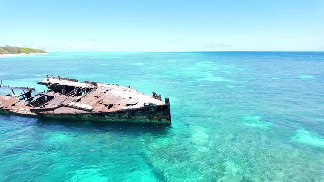 Shipwreck HMAS Protector used for an artificial reef and marine sanctuary for a protected coral cay on the Great Barrier Reef Queensland Australia