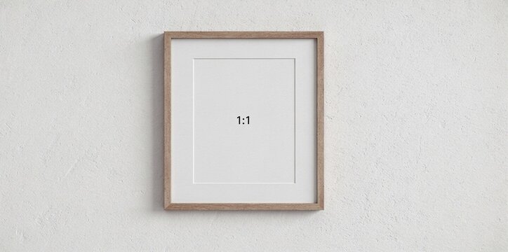 Square 1:1 aspect ratio picture frame with natural wood border, mounted on a textured wall. Perfect mockup for social media, photos, or small art pieces.