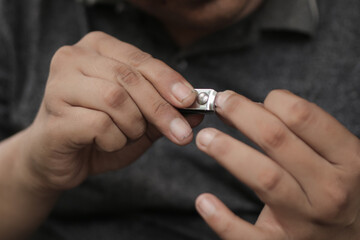 A man cuts his nails