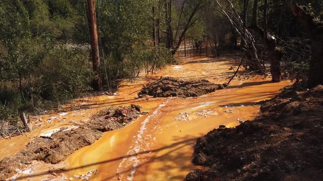 Acid mine drainage from copper mine and lime neutralizing reaction. Flowing toxic waters