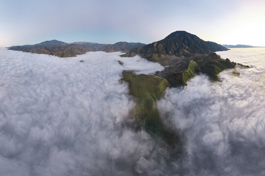 Aerial View of Fog Rolling Through the Green Verdant Hills in So
