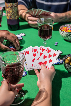 Holding playing cards during a fun poker game