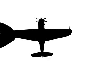 指でつままれたシルエットのプロペラ戦闘機