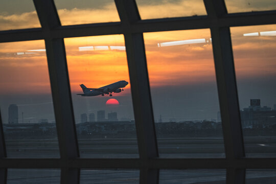 the plane just over the sunset