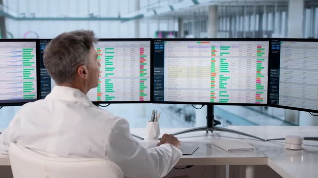 Doctor Working On Medical Billing And Coding Spreadsheet
