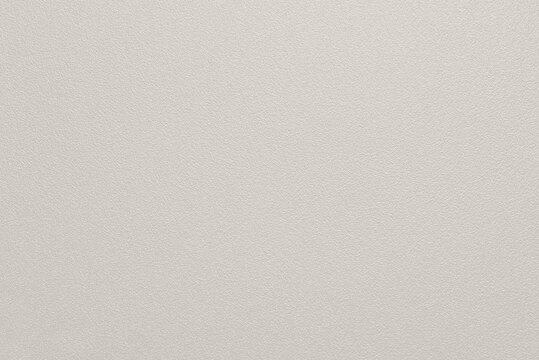 Abstract smooth grainy paint texture background, uniform greige pastel surface