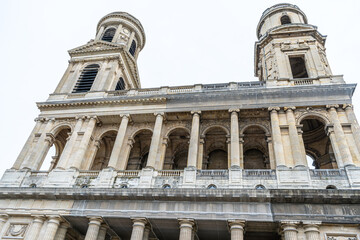 Fototapeta premium Low Angle View of Saint-Sulpice Church Facade. Paris city old architecture. France building.