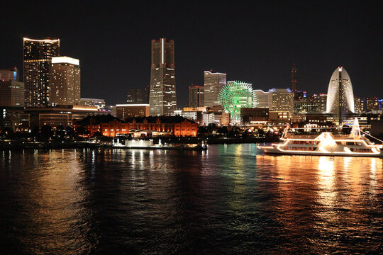 Night view of Minato Mirai Yokohama with illuminated Ferris wheel and houseboat