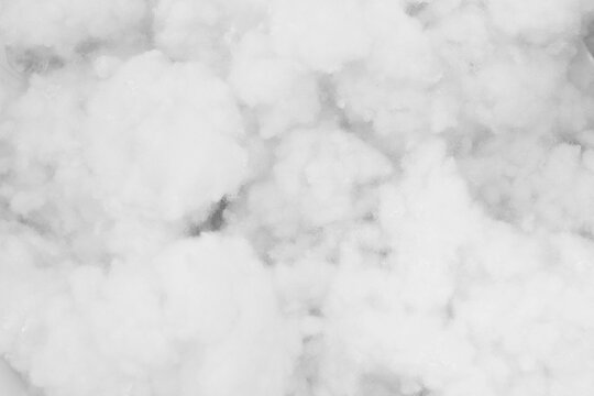 close-up texture of white cotton wadding or polyester fiber stuffing.