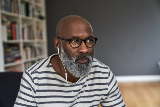 Portrait of a nature man listening with earphones