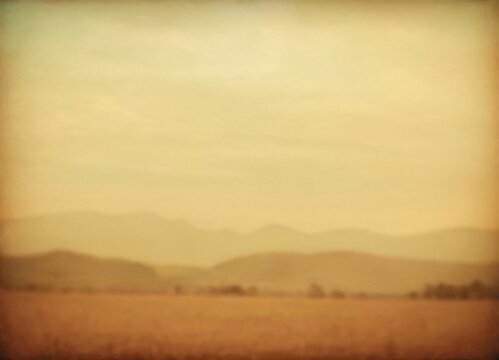 vintage countryside with gentle mists, pastoral landscape bathed in amber glow and soft haze