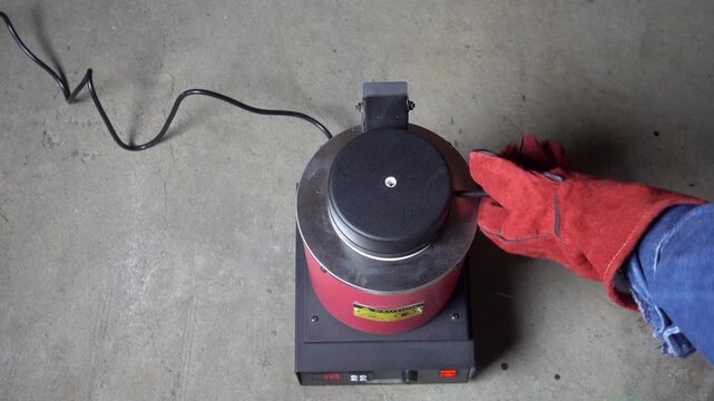 Unmelted borax is torched inside crucible.