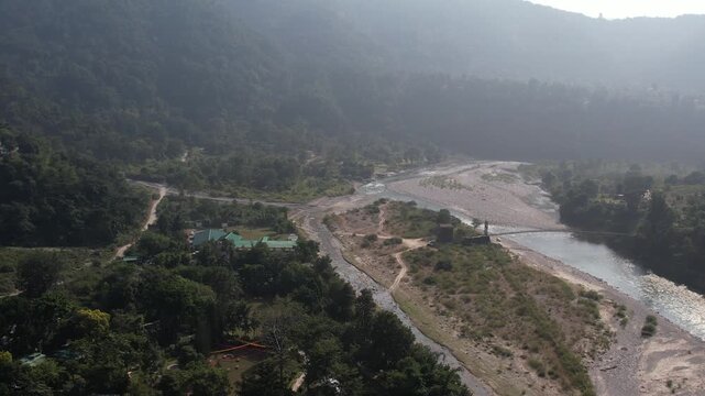 Aerial drone view of Jim Corbett National Park river valley, dense forest and scenic Uttarakhand landscape, India
