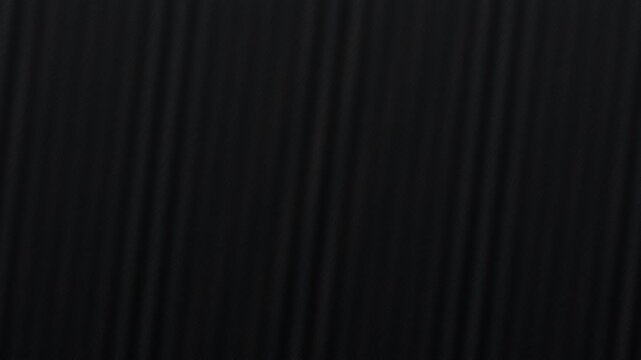 Waves ripple through gradients of gray and black