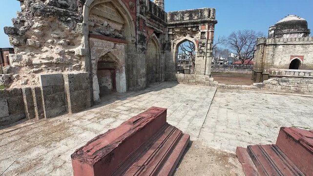 Ancient burial site and monumental memorial of a local Nawab's family showcasing intricate Islamic stone masonry and historic heritage in Jhajjar.