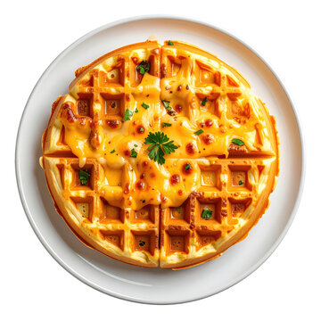 Golden waffle drizzled with syrup and garnished with fresh mint leaves on white plate isolated white background
