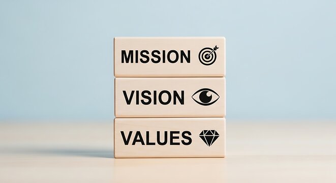 Business core values mission and vision text printed on wooden toy bricks arranged in vertical pillar format
