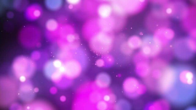Abstract background with a soft bokeh of blurred glowing circles in warm pink and purple tones.